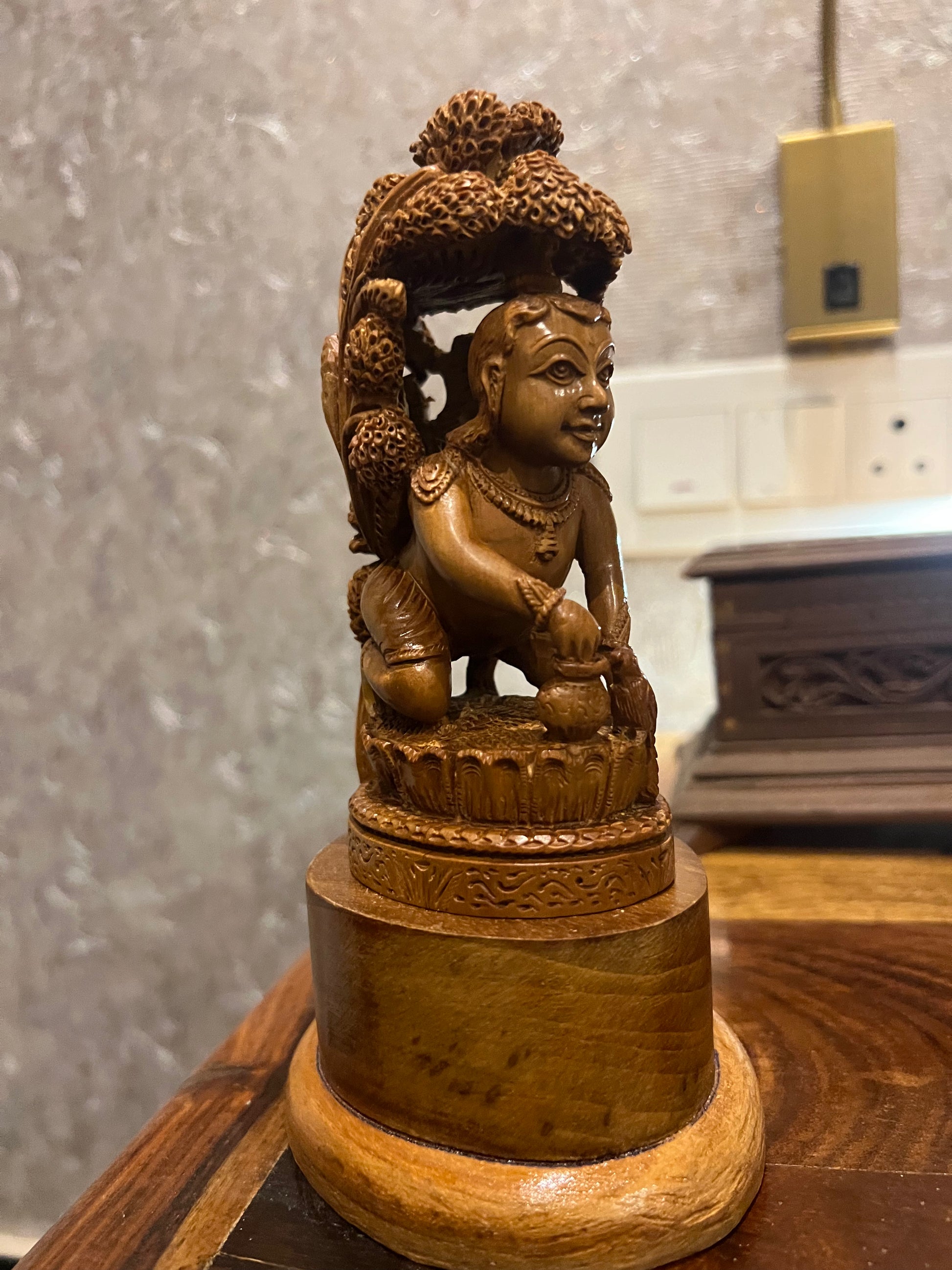 Sandalwood Baby Krishna Eating Makhan Under Tree