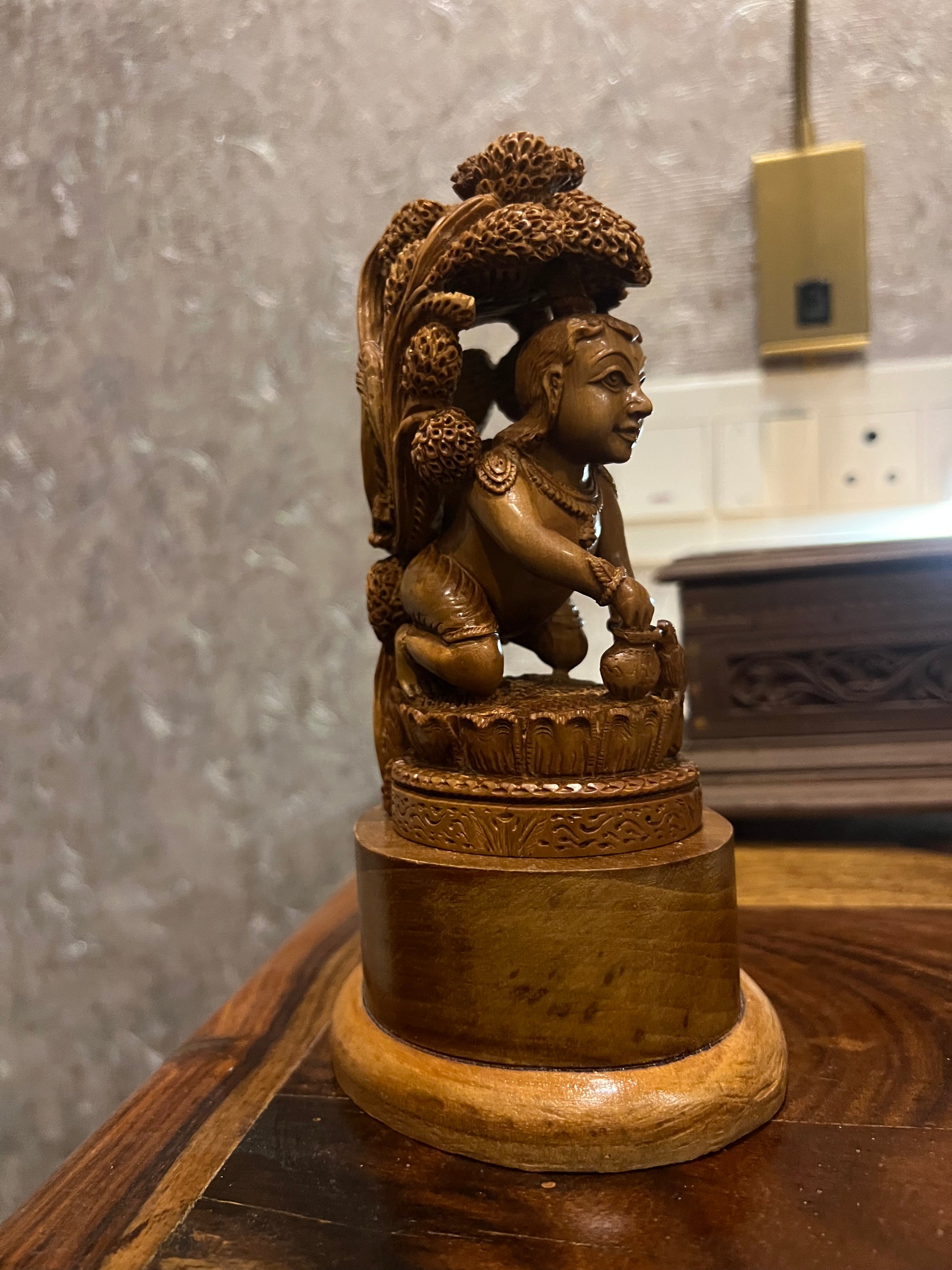 Sandalwood Baby Krishna Eating Makhan Under Tree