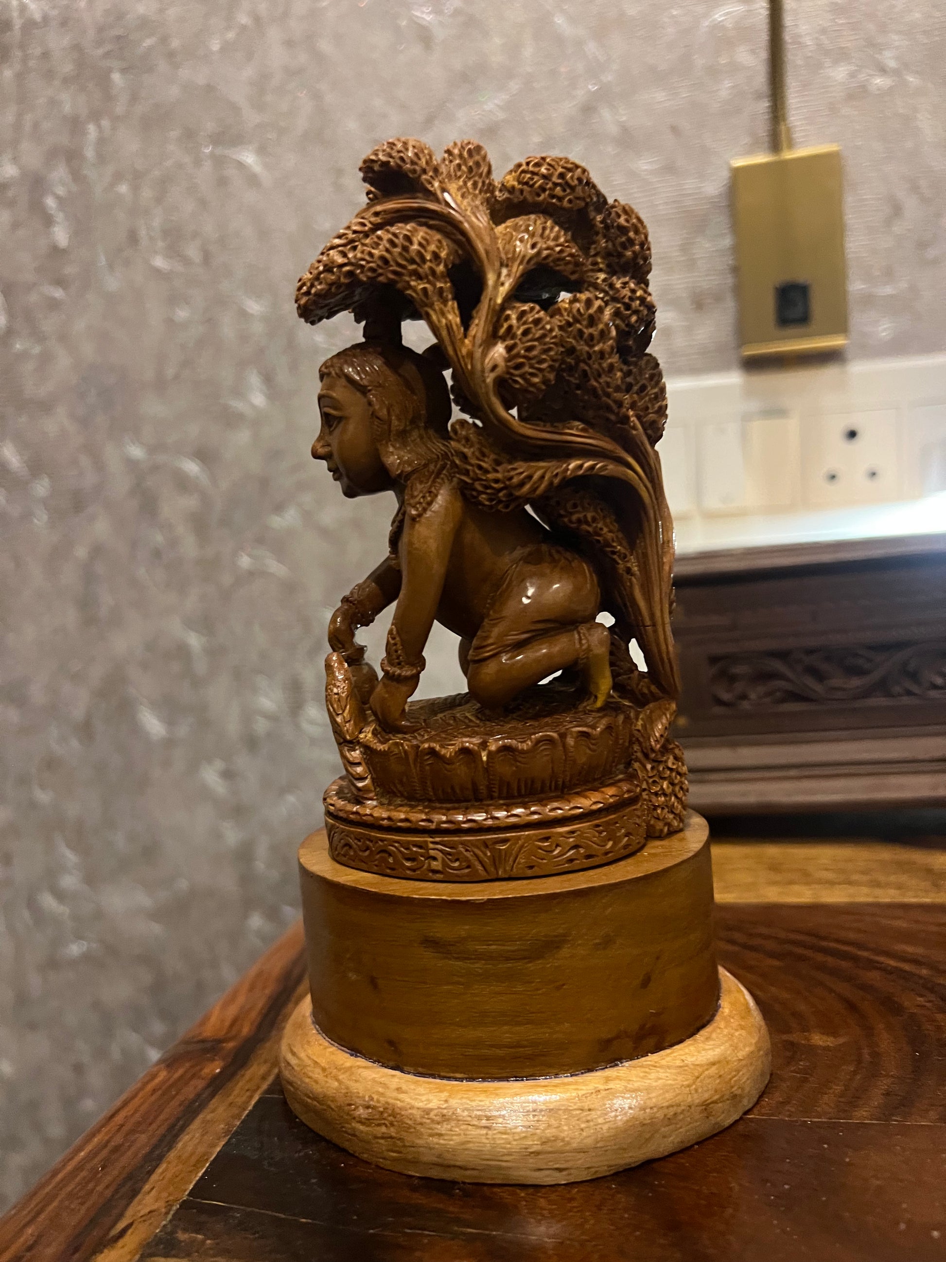 Sandalwood Baby Krishna Eating Makhan Under Tree