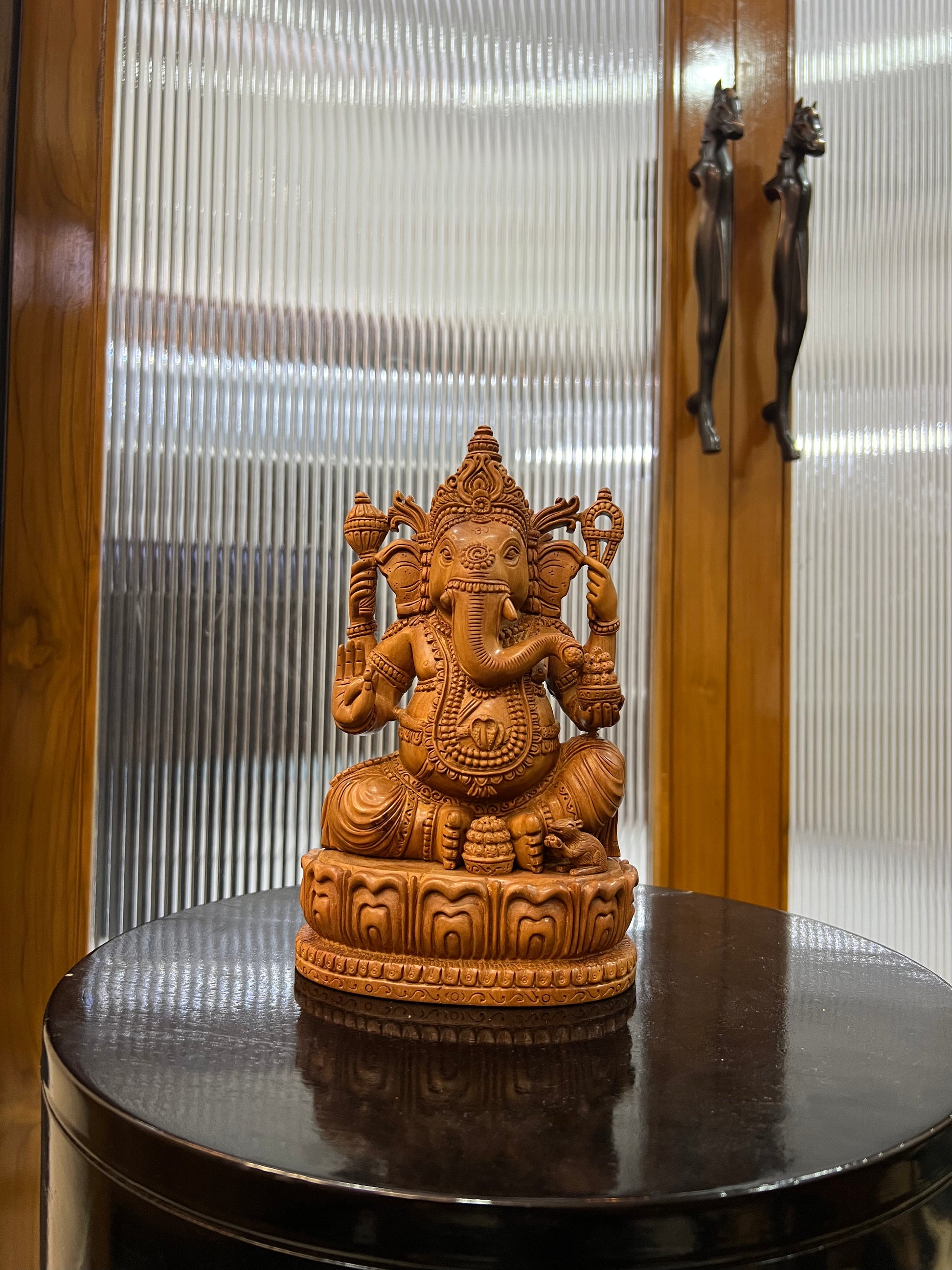 exquisite sandalwood carving features Lord Ganesha (9" inches)
