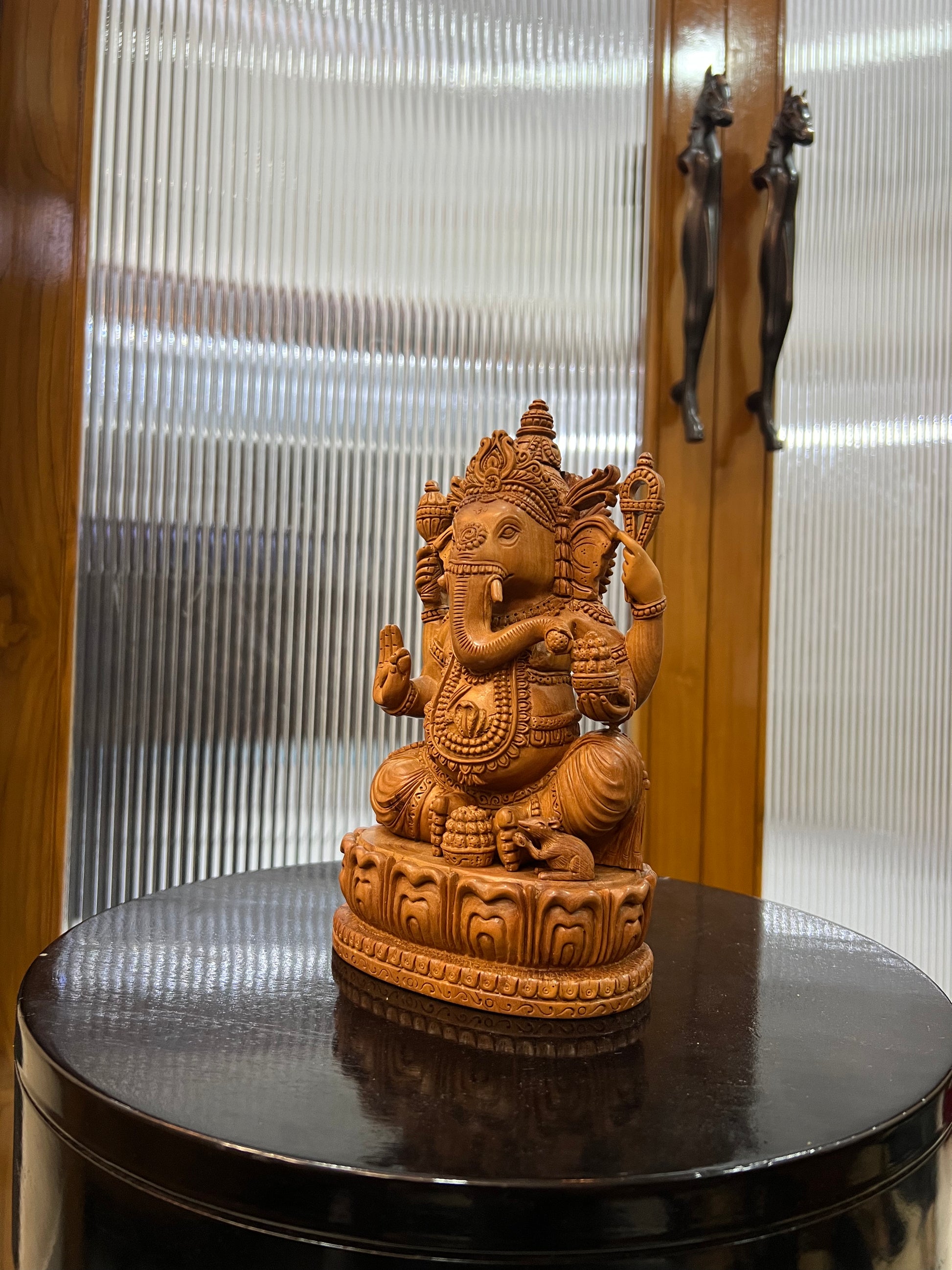 exquisite sandalwood carving features Lord Ganesha (9" inches)