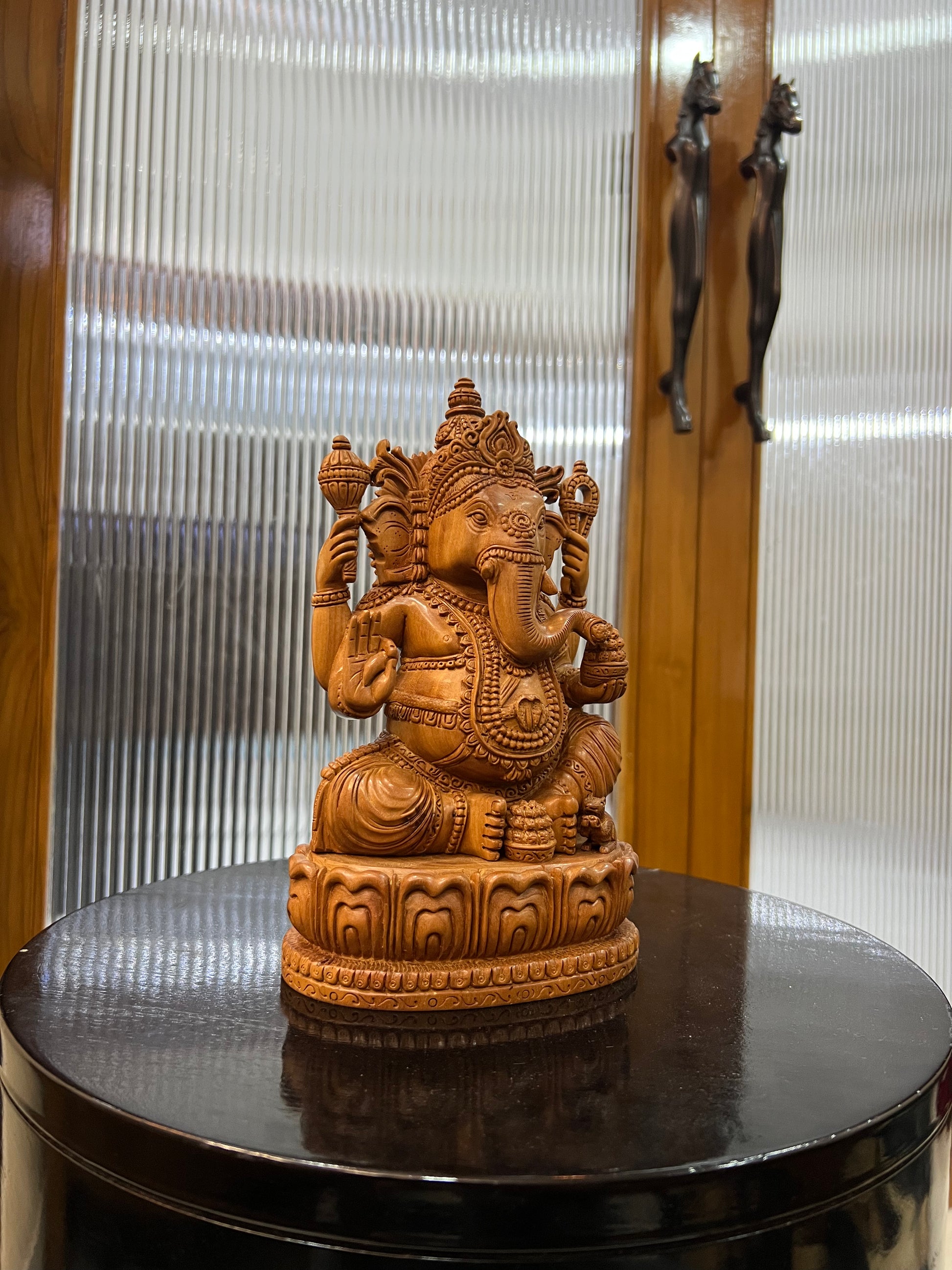 exquisite sandalwood carving features Lord Ganesha (9" inches)