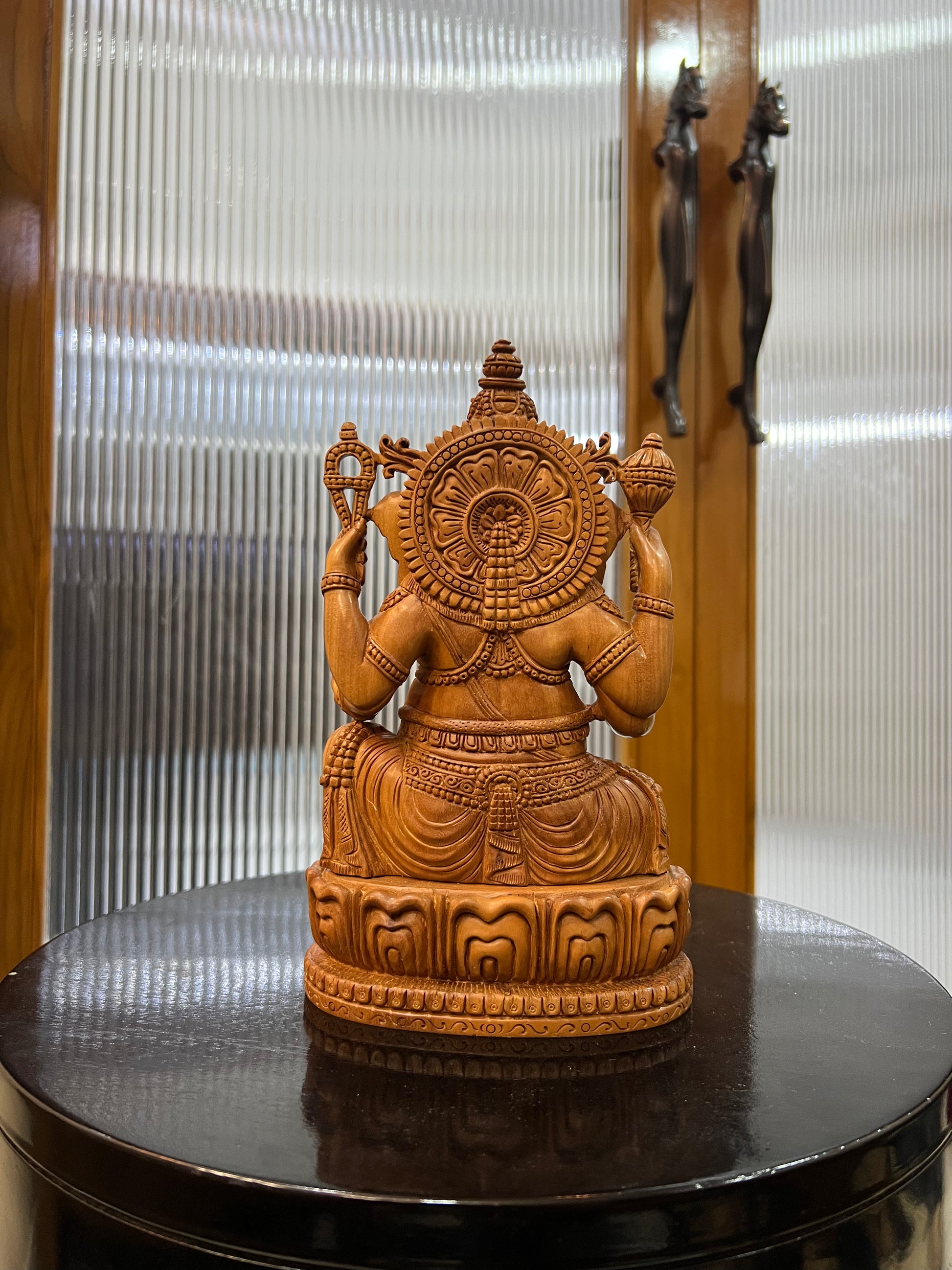exquisite sandalwood carving features Lord Ganesha (9" inches)