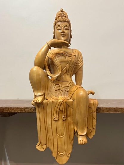 Wooden hand carved collective buddha sitting