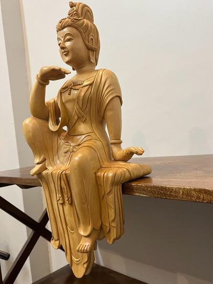 Wooden hand carved collective buddha sitting