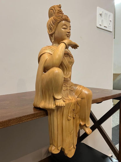 Wooden hand carved collective buddha sitting