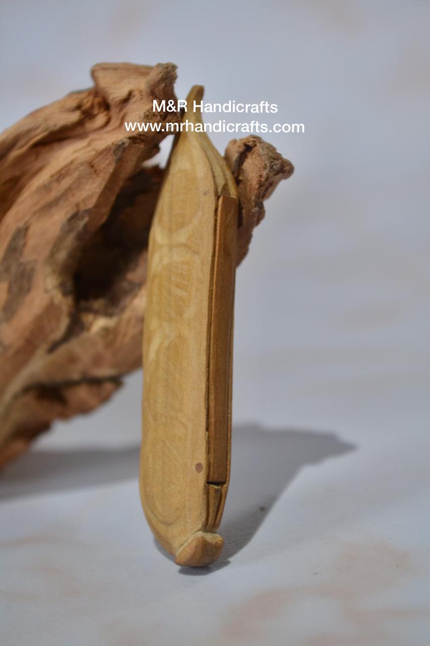 Sandalwood Miniature Carved Peapod Bean Features The Makkah Madina Inside - Arts99 - Online Art Gallery