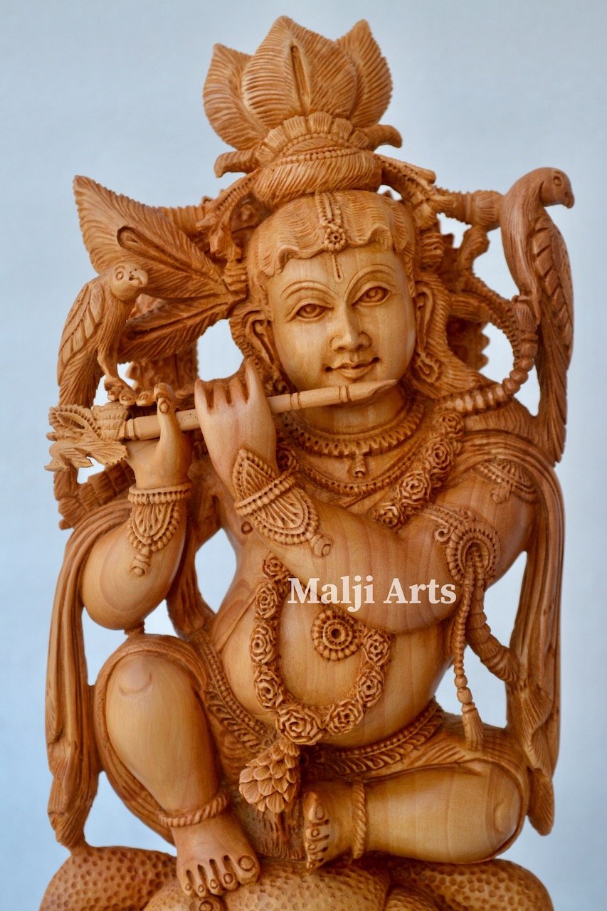 Baby Krishna sitting on snack fine wooden hand carved statue - Arts99 - Online Art Gallery