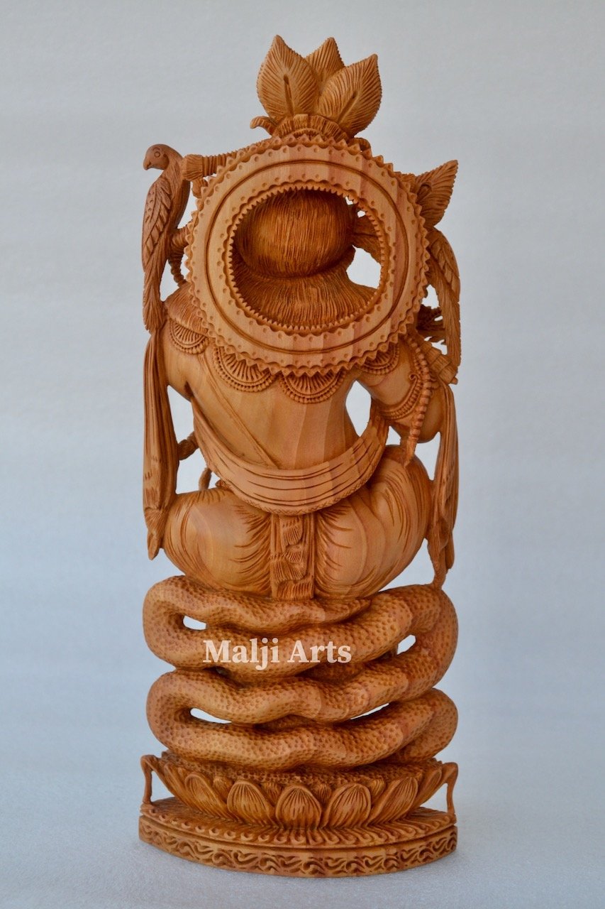 Baby Krishna sitting on snack fine wooden hand carved statue - Arts99 - Online Art Gallery