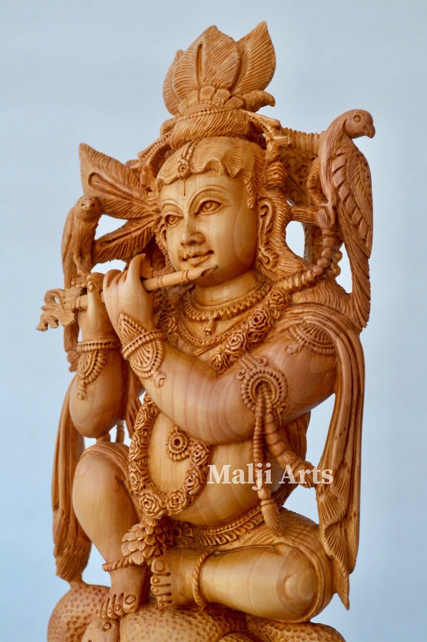 Baby Krishna sitting on snack fine wooden hand carved statue - Arts99 - Online Art Gallery