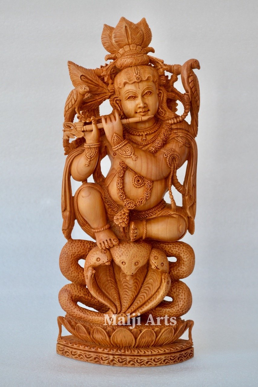 Baby Krishna sitting on snack fine wooden hand carved statue - Arts99 - Online Art Gallery