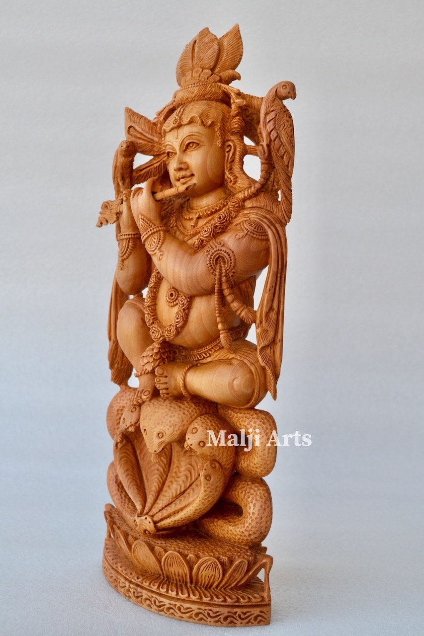 Baby Krishna sitting on snack fine wooden hand carved statue - Arts99 - Online Art Gallery